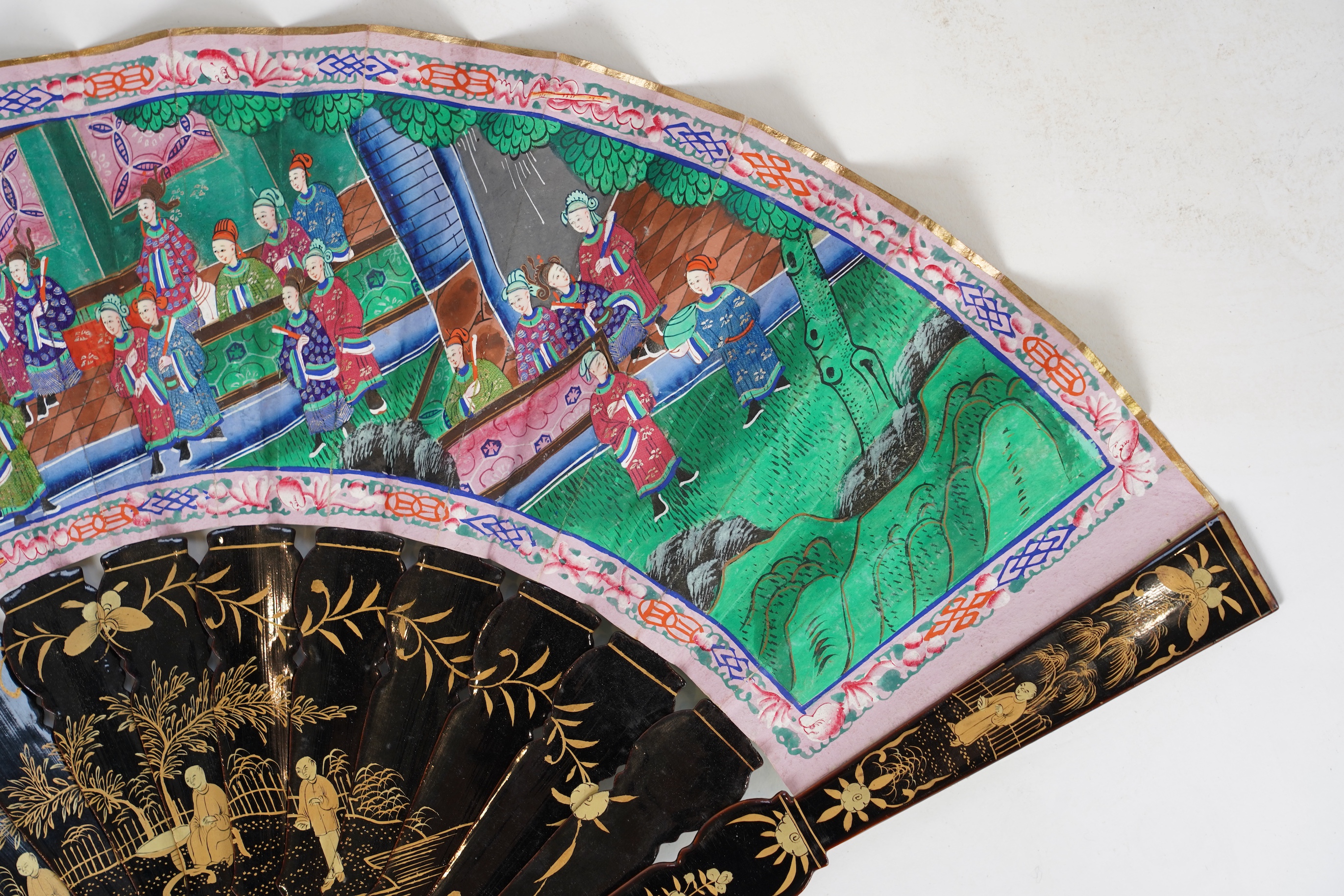 Three Chinese gilt-decorated black lacquer and painted leaf fans, 19th century
